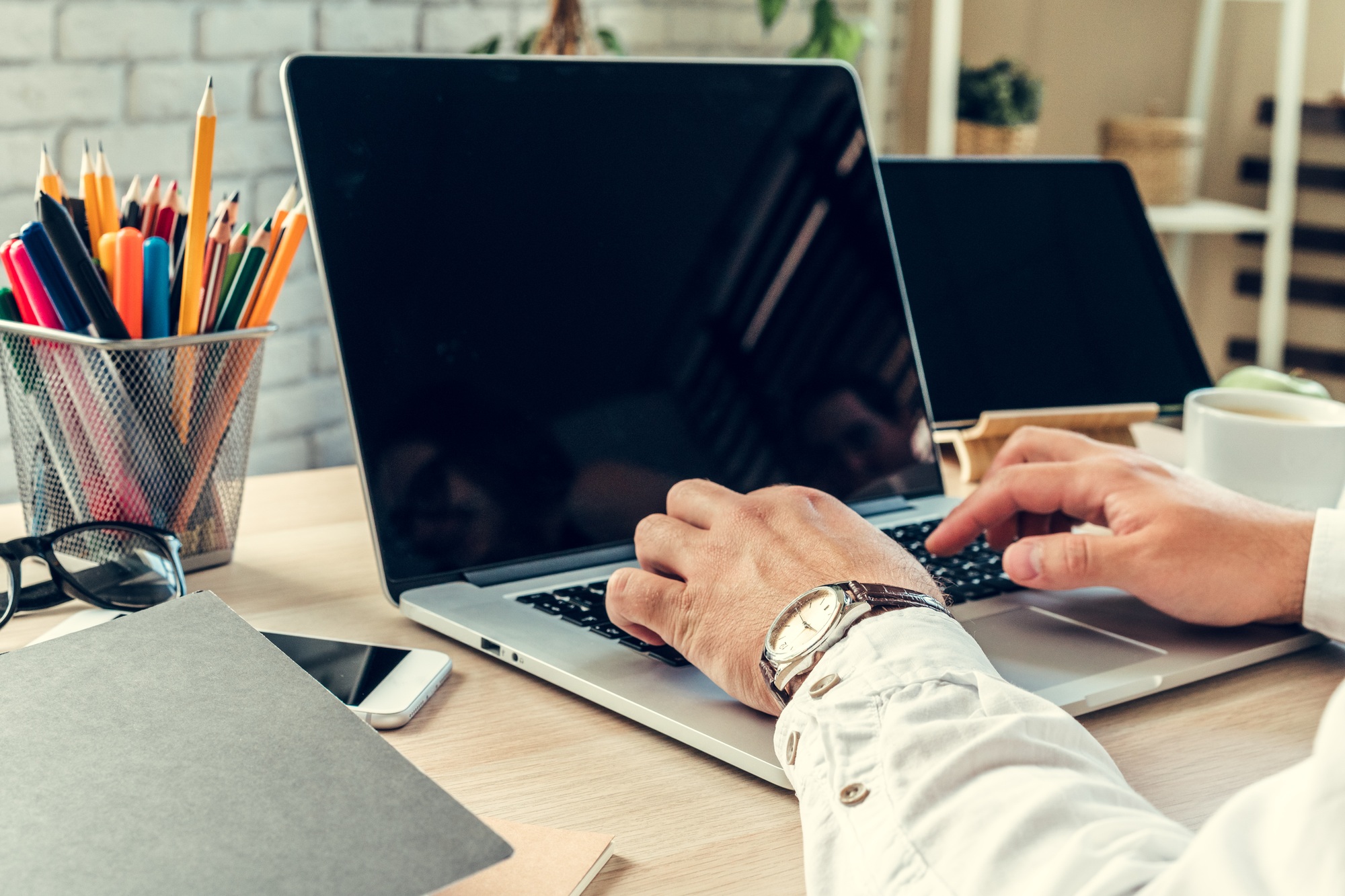 Close up of a working table of a businessman with laptop